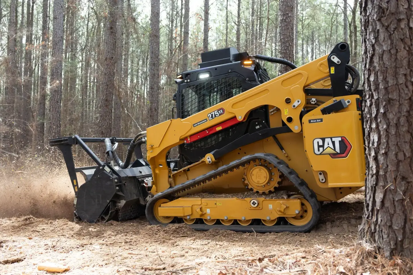 Caterpillar track loader running a forestry mulcher head — Pine Barrens Land & Forestry